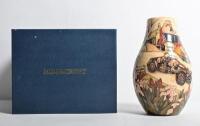 MOORCROFT/ASTON MARTIN: A limited edition Moorcroft porcelain 'Aston Hill Climb' vase, edition 144 of 150