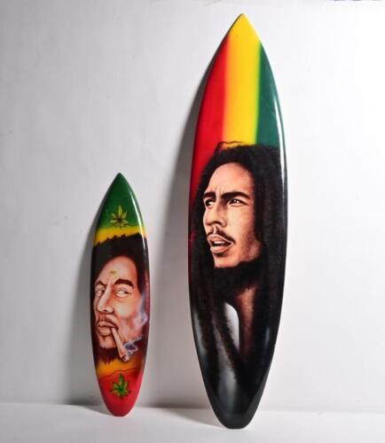 BOB MARLEY: Two timber novelty surfboard painted with Bob Marley / rastafarian scenes,&nbsp;largest measuring 99cm&nbsp;high,&nbsp;23.5cm wide.