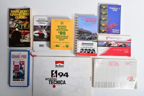 GRAND PRIX GUIDES: A collection of Grand Prix guides, predominantly from Marlboro. Marlboro 'F194 analisi TECNICA' softcover book by Giorgio Piola