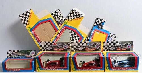 FORMULA 1: A group of 1:43 YAXON Formula 1 related models and boxes. Two Ferrari T4's (art. 0700) & Ligier JS11 (art 0711) models