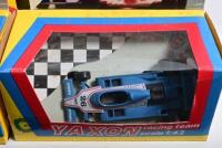 FORMULA 1: A group of 1:43 YAXON Formula 1 related models and boxes. Two Ferrari T4's (art. 0700) & Ligier JS11 (art 0711) models - 2