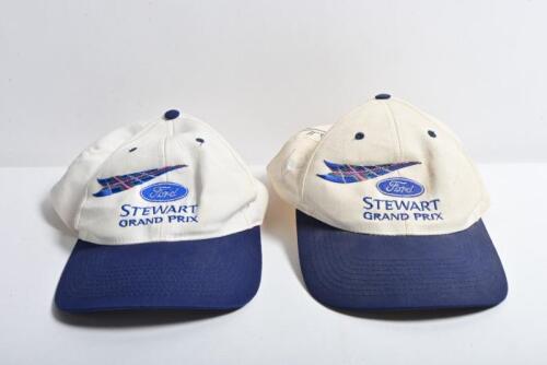 STEWART FORD: Two 'Ford STEWART GRAND PRIX' caps. One cap signed by Jackie Stewart, Sir Jack Brabham, Glen Ridge, George Harrison. Interesting item