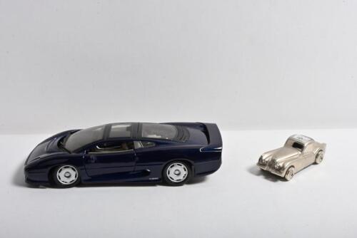 JAGUAR: Two Jaguar related items. Pewter Jaguar XK150 with Landmark clock to roof & Maisto Jaguar XJ220 in dark blue