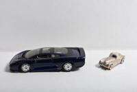 JAGUAR: Two Jaguar related items. Pewter Jaguar XK150 with Landmark clock to roof & Maisto Jaguar XJ220 in dark blue