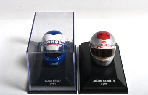 MODEL HELMETS: Two helmets by Paul's Model Art/MINICHAMPS in 1:8 scale. 'ALAIN PROST 1989' Formula 1 helmet & 'MARIO ANDRETTI 1995' IndyCar helmet