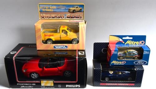 MODEL CARS: Four diecast model cars. PORSCHE Boxster, Special Edition 'Philishave FOR THE MAN INSIDE' & Classic Carlectables Mark Larkham's Mitre 10 Racing Falcon