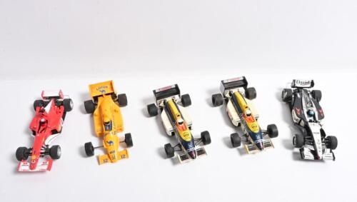 F1 SLOT CARS: A group of F1 slot cars by Carrera Evolution and Scalextric. Carrera Evolution Ferrari, McLaren Mercedes-Benz & Scalextric Williams FW11, Lotus Honda
