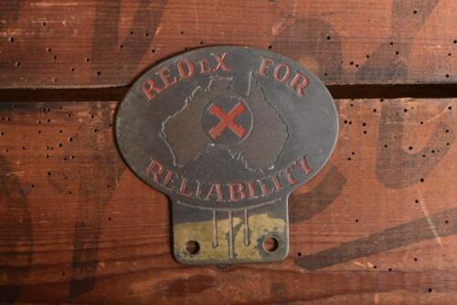 REDEX: A REDEX FOR RELIABILITY' car badge. Brass