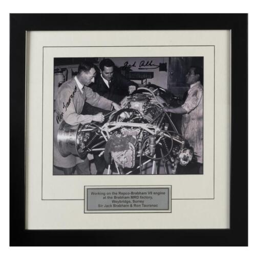 BRABHAM: A black and white image of Sir Jack Brabham and Ron Tauranac, with mechanic, working on the Repco-Brabham V8 engine at the Brabham MRD factory, Weybridge, Surrey. Image signed by Sir Jack Brabham and designer Ron Tauranac