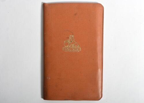 HOLDEN: An official HOLDEN tan vinyl pouch. Pouch with 1965 Holden HD 'HOLDEN OWNER MANUAL', 'HOLDEN OWNER PROTECTION PLAN' service booklet & NASCO Accessories booklet, 'AIR CHIEF' car radio Owner's Manual