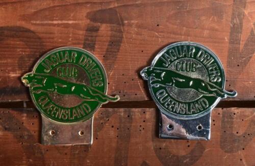 JAGUAR DRIVERS CLUB: Two 'JAGUAR DRIVERS CLUB, QUEENSLAND' car badges. One chrome, one brass