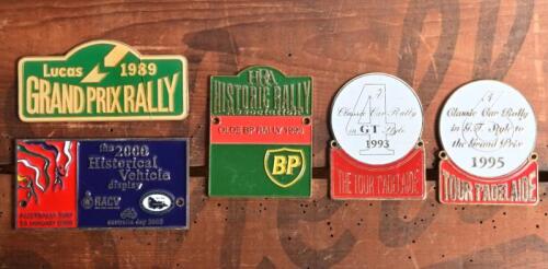 RALLY BADGES: Five car rally badges. 'Lucas 1989 GRAND PRIX RALLY', 'THE TOUR T'ADELAIDE - A Classic Car Rally in GT Style 1993', 'TOUR T'ADELAIDE - A Classic Car Rally in G.T. Style to the Grand Prix 1995, BP 'HRA HISTORIC RALLY Association OLDE BP RALLY