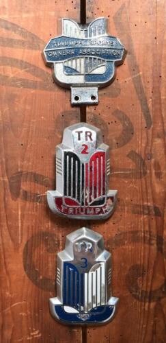 TRIUMPH: Three Triumph badges. TR 2 & TR 3 badges