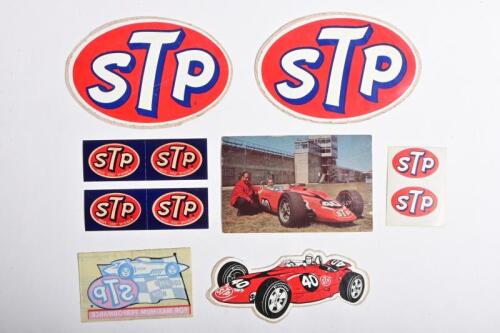 STP: A collection of STP adhesives and postcard. 'STP' logo stickers