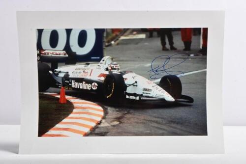 MANSELL: A colour picture of Nigel Mansell racing the Kmart Lola T94/00-Ford at 1994 Gold Coast Indy Car. Nigel Mansell signature