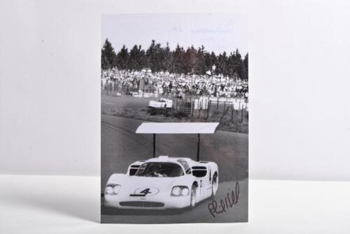 HILL: A black and white laminated picture of Phil Hill racing a Chaparral 2F at the Nurburgring, 1967. Phil Hill signature
