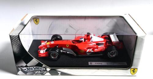 FERRARI: A 1:18 scale Hotwheels Racing Ferrari F2005 Formula 1 model as raced by Rubens Barrichello. Display box sealed