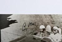 MOSS: A black and white picture from the Daimler-Benz Archive depicting Stirling Moss and Denis Jenkinson racing a Mercedes-Benz 300 SLR at the 1955 Mille Miglia. Stirling Moss signature - 2