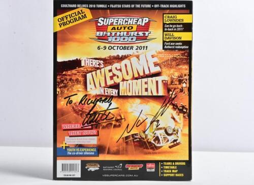 BATHURST: A BATHURST 2011 OFFICIAL PROGRAM' for the 'SUPERCHEAP AUTO BATHURST 1000' October 6-9. Front cover signed by race winners Garth Tander & Nick Percat