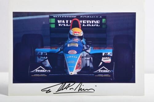 MINARDI: A colour picture of Pierluigi Martini racing a Minardi-Ford at 1994 Spanish Grand Prix. Martini signature