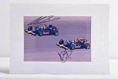 RED BULL: A colour picture of Alex Barron and Patrick Carpentier from the Red Bull Cheever Racing Indy Car team driving in the IndyCar Series. Alex Barron & Patrick Carpentier signatures
