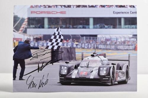PORSCHE: A colour picture of the Porsche 919 Hybrid racing to victory at Le Mans 2016, as driven by Marc Lieb, Romain Dumas, Neel Jani. Picture signed by all three drivers