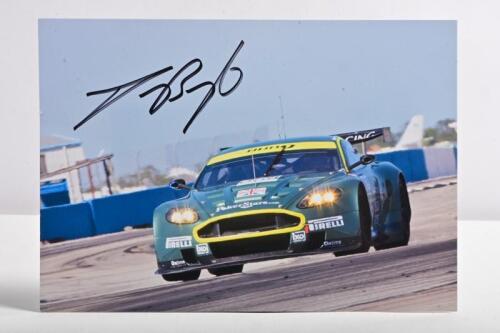BRIGHT: A colour picture of Jason Bright driving an Aston Martin DBR9. Jason Bright signature