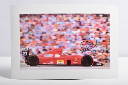 FERRARI/MANSELL: A colour picture of Nigel Mansell racing a F1-89 at the 1989 German Grand Prix. Nigel Mansell signature