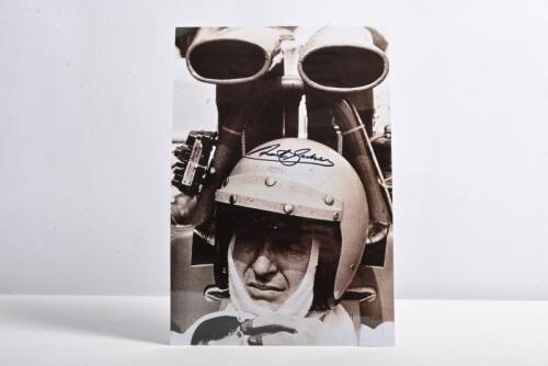 GARDNER: A black and white laminated image of Frank Gardner sitting in the cockpit of a Lola T300 F5000. Gardner signature
