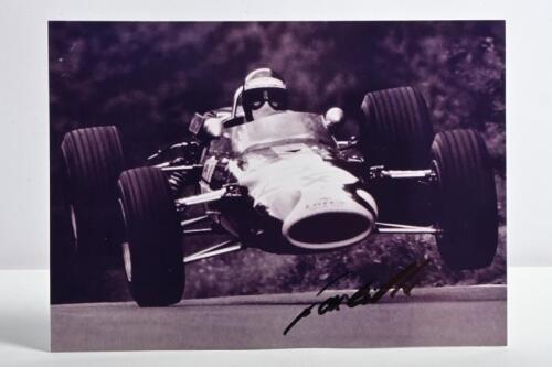 OLIVER: A black and white picture of Jackie Oliver racing a Lotus-Ford 48 at 1967 German Grand Prix, Nurburgring. Oliver signature
