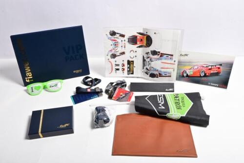 WEC: A collection of items related to the World Endurance Championship (WEC). Flags, sunglasses, tickets with lanyards, collector card pack