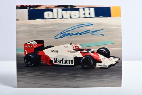 LAUDA: A colour picture of Niki Lauda racing a McLaren MP4/2. Picture signed by Niki Lauda