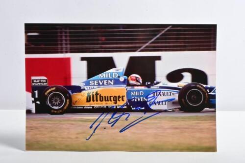 SCHUMACHER: A colour image of Michael Schumacher racing a Benetton B195. Picture signed by Michael Schumacher