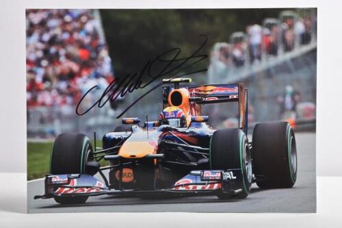 WEBBER: A colour picture of Mark Webber in a Red Bull Formula 1 car. Mark Webber signature