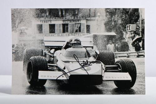 ICKX: A black and white picture depicting Jacky Ickx racing a Ferrari 312 at Monaco 1972. Picture signed by Jacky Ickx