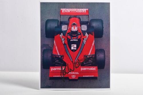WATSON: A colour picture of John Watson racing a Brabham BT46. John Watson signature