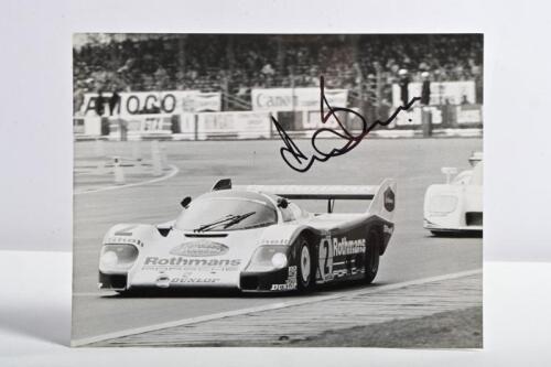 BELL: A superb black and white picture from 1983 of Derek Bell racing a Rothmans Porsche 956 to victory at the Silverstone 1000Kms. Picture signed by Derek Bell