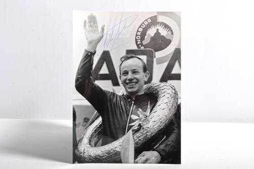 SURTEES: A black and white victory picture of John Surtees from the Nurburgring. John Surtees signature