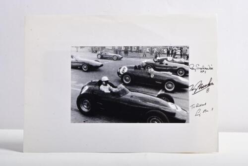 BROOKS/MOSS/SALVADORI: A black and white image of Roy Salvadori, Tony Brooks and Stirling Moss on a starting grid. Picture signed by all drivers
