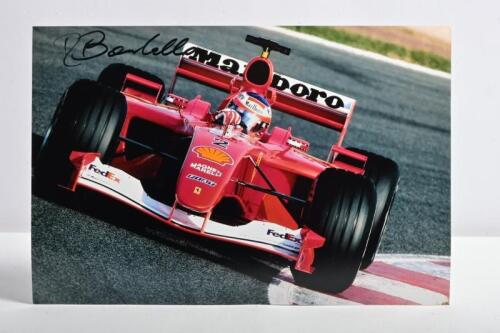 BARRICHELLO: A colour picture of Rubens Barrichello racing a Ferrari F2004. Picture signed by Rubens Barrichello