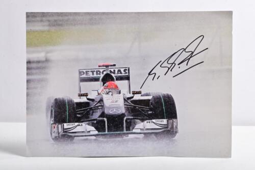 SCHUMACHER: A colour image of Michael Schumacher racing a Mercedes-Benz MGP W01. Picture signed by Michael Schumacher
