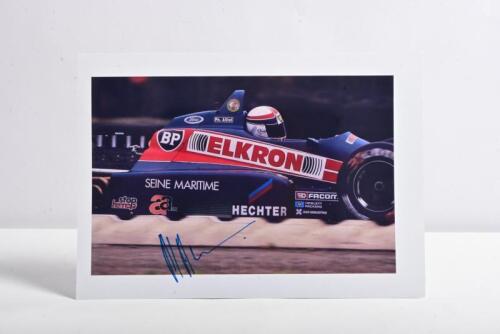 ALLIOT: A colour picture of Philippe Alliott racing a Larrousse Lola LC8, picture signed by Philippe Alliot