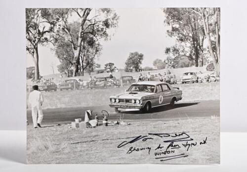 BEECHEY: A black and white picture of Norm Beechey's XY GTHO Ford Falcon blowing a rear tyre at Winton. Norm Beechey signature