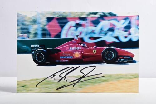 SCHUMACHER: A colour image of Michael Schumacher racing a Ferrari F310, picture signed by Michael Schumacher