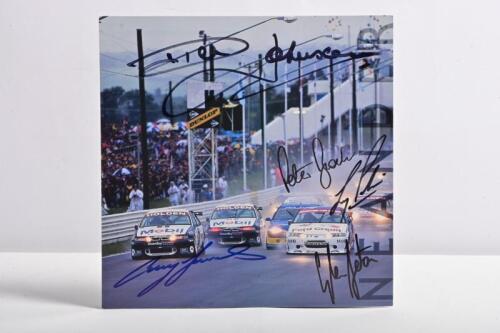 BATHURST: A Graeme Neander studio sheet depicting the start of the 1996 AMP Bathurst 1000. Sheet signed by Peter Brock, Craig Lowndes, Dick Johnson, Larry Perkins, Glenn Seton
