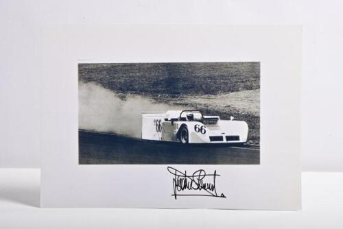 STEWART: A black and white picture of Jackie Stewart driving the Chaparral 2J "Vacuum" car. Jackie Stewart signature