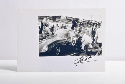 SURTEES: A black and white victory picture of John Surtees in the pits with a Ferrari 250 GTO. Surtees signature