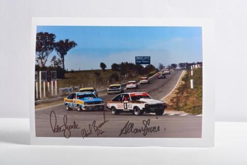 BATHURST: A colour picture depicting the racing Holden Torana A9X's of Allan Grice and Peter/Phil Brock from Bathurst 1977. Picture signed by Peter and Phil Brock with Allan Grice. Superb