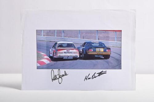BROCK/BARTLETT: A colour picture on paper of Peter Brock in a HDT VH Holden Commodore and Kevin Bartlett in a Chevrolet Camaro racing at Hell's Corner, Bathurst 1982. Picture signed by both drivers