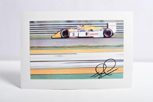 MANSELL: A colour picture of Nigel Mansell racing the Williams F1 FW11B during the 1987 Formula 1 season. Nigel Mansell signature